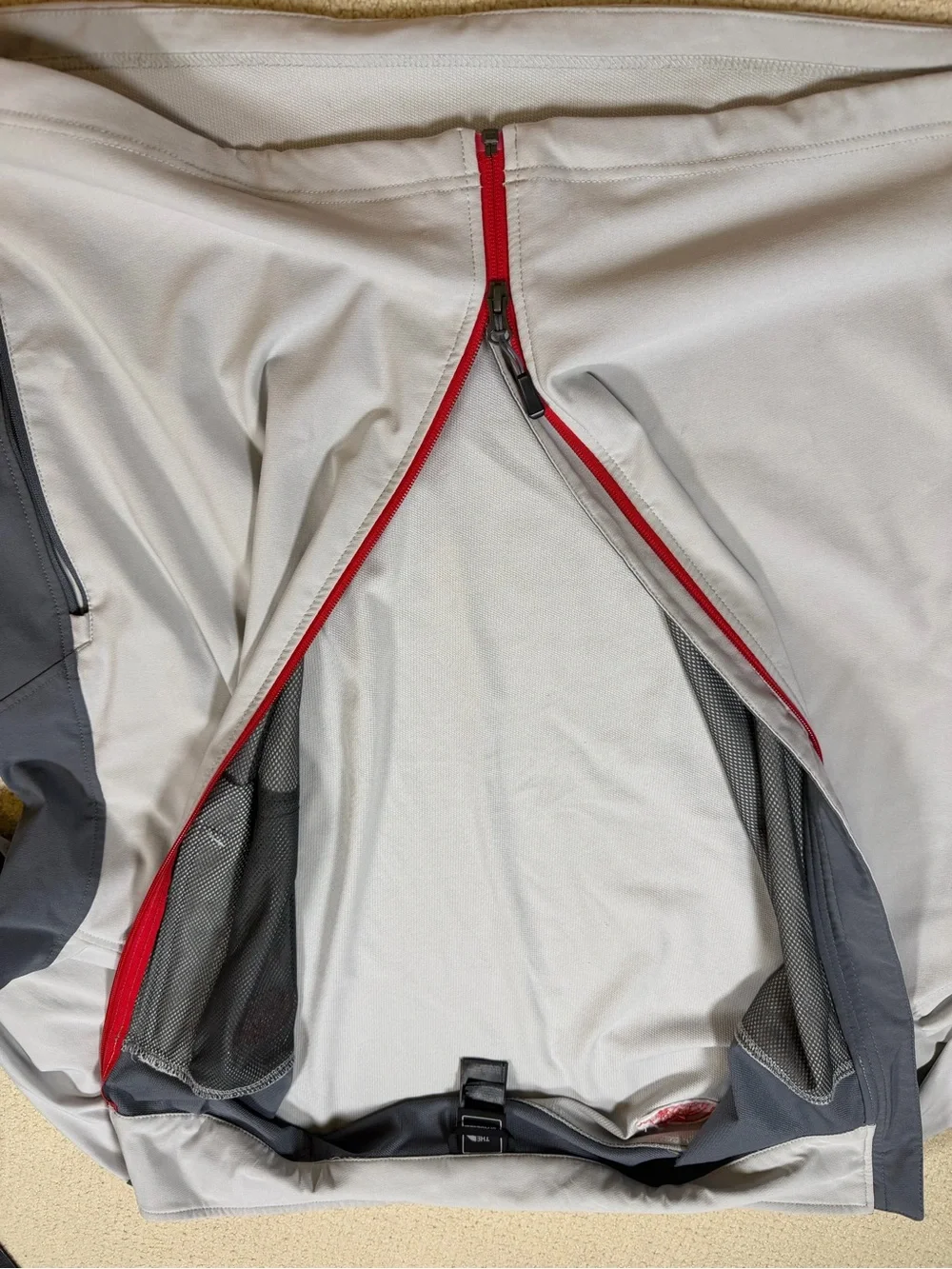 The North Face Men’s Gray Jacket with Red Zipper